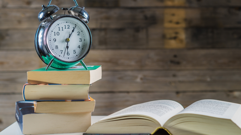 A stack of unfinished books during a reading slump